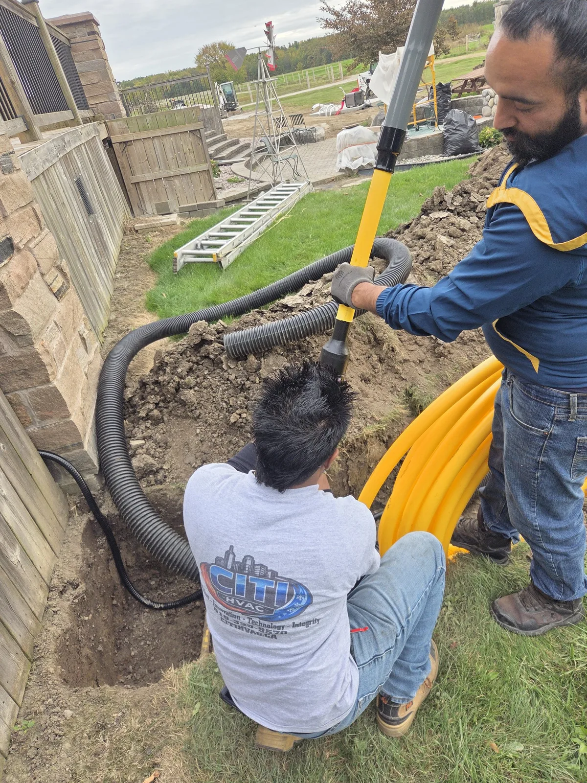 CITI HVAC technicians fusing underground polyethylene gas line in trench — Essex ON