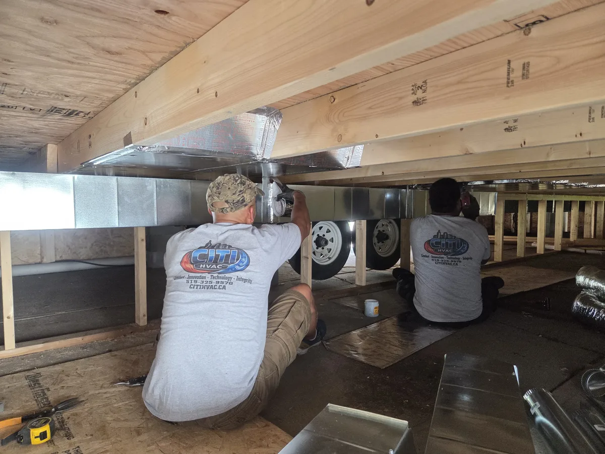 CITI HVAC team installing ductwork under park trailer — Chatham ON