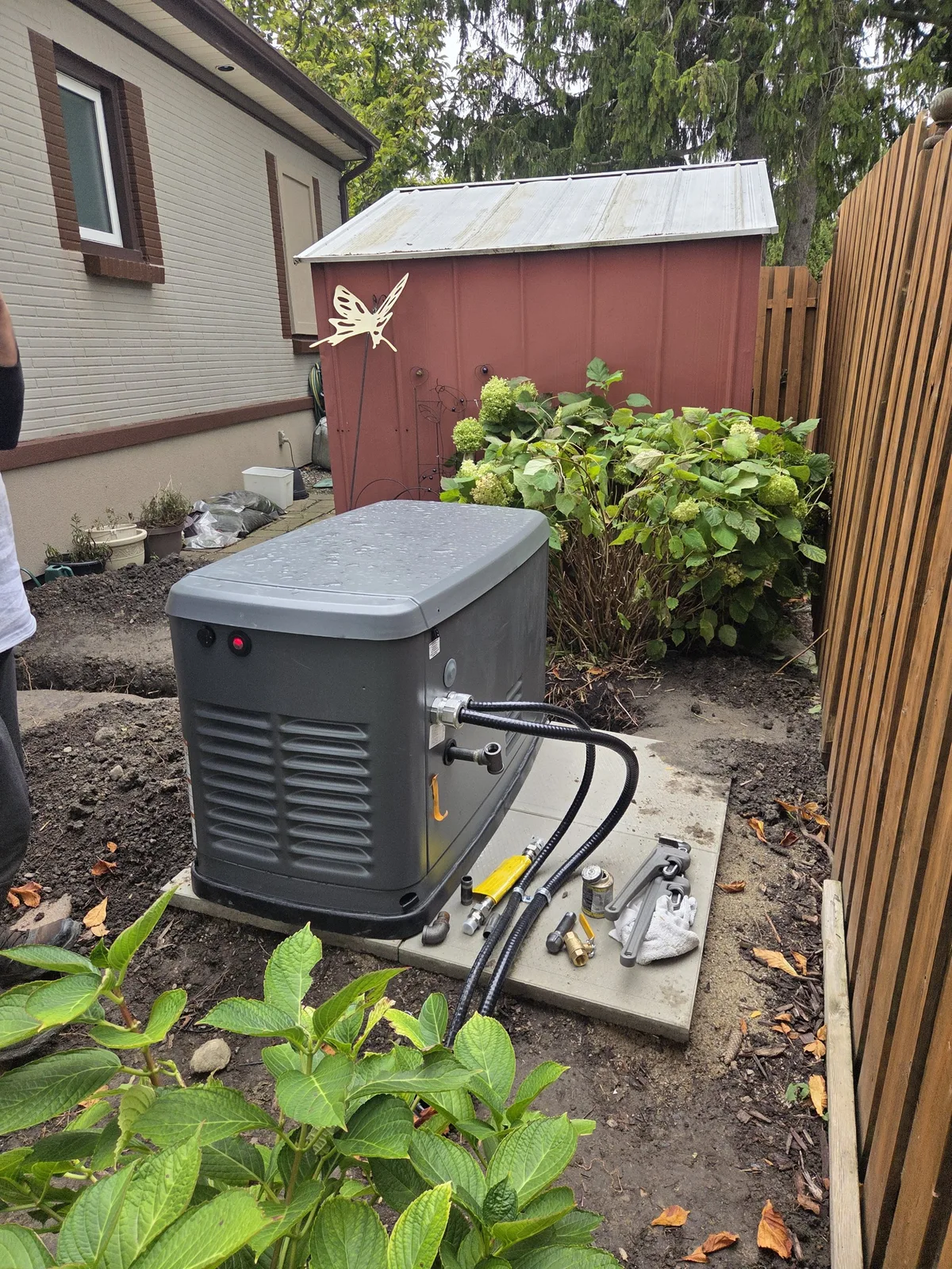 Generator on pad with gas fittings laid out before connection — Tecumseh ON