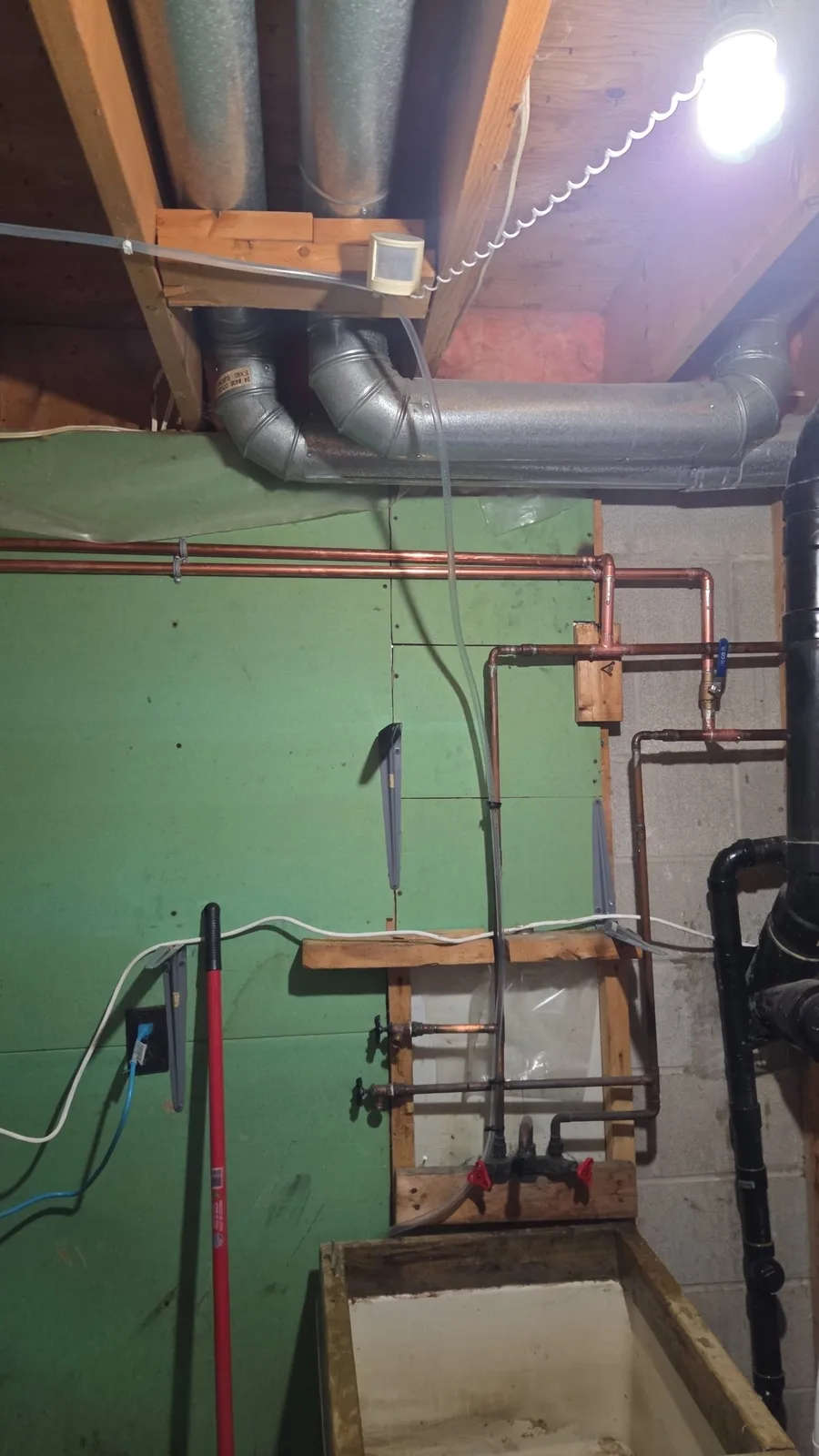 Copper water supply and return lines run to a tankless water heater