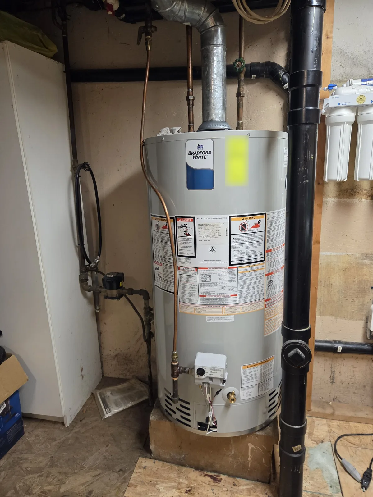 Conventional vent gas tank water heater with new gas and copper water connections